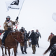 Military veterans approach the the blockade that has been keeping self-described “Water Protectors” from advancing towards the pipeline project.